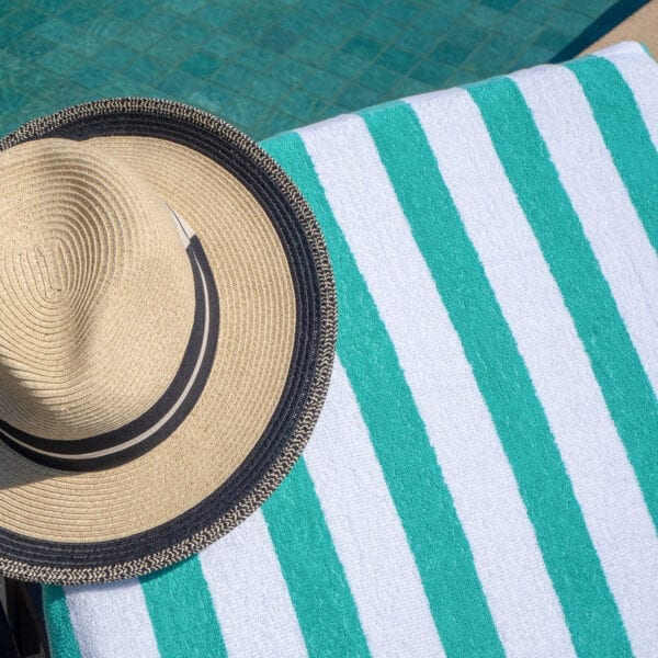 California Cabana Towels - Green on a pool chair