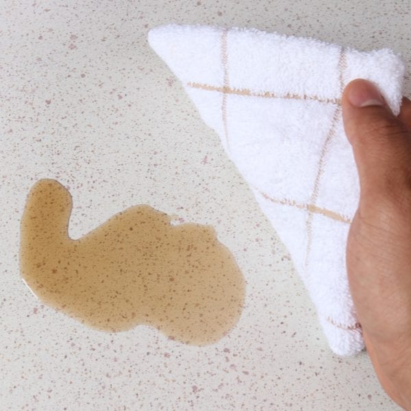 Terry Kitchen Dish Towel - Tan used to clean spill on counter