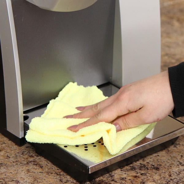 M950Y wiping down coffee machine