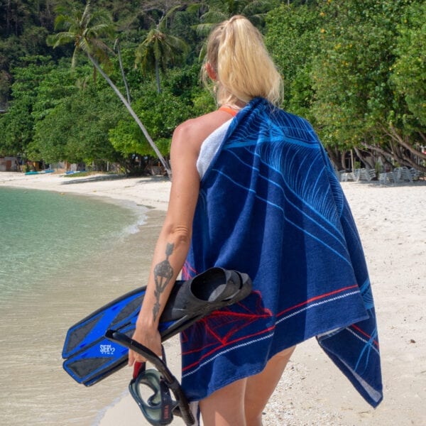 Woman caring scuba gear and Printed Beach Towel - Sailboats