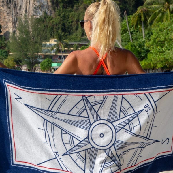 Woman holding a Printed Beach Towel - Compass