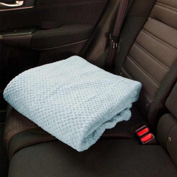 Pineapple Trading Company Coral Fleece Throws - folded in car