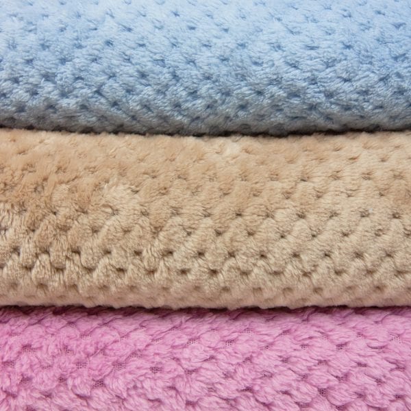 Pineapple Trading Company Coral Fleece Throws - folded and stacked closeup