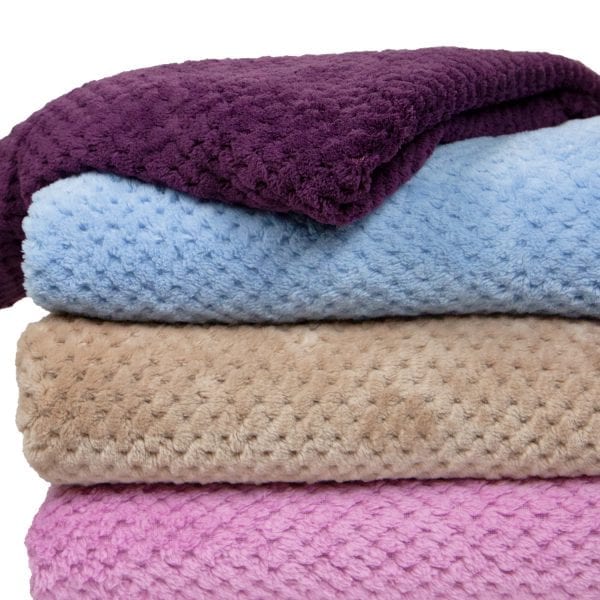 Pineapple Trading Company Coral Fleece Throws - folded and stacked closeup